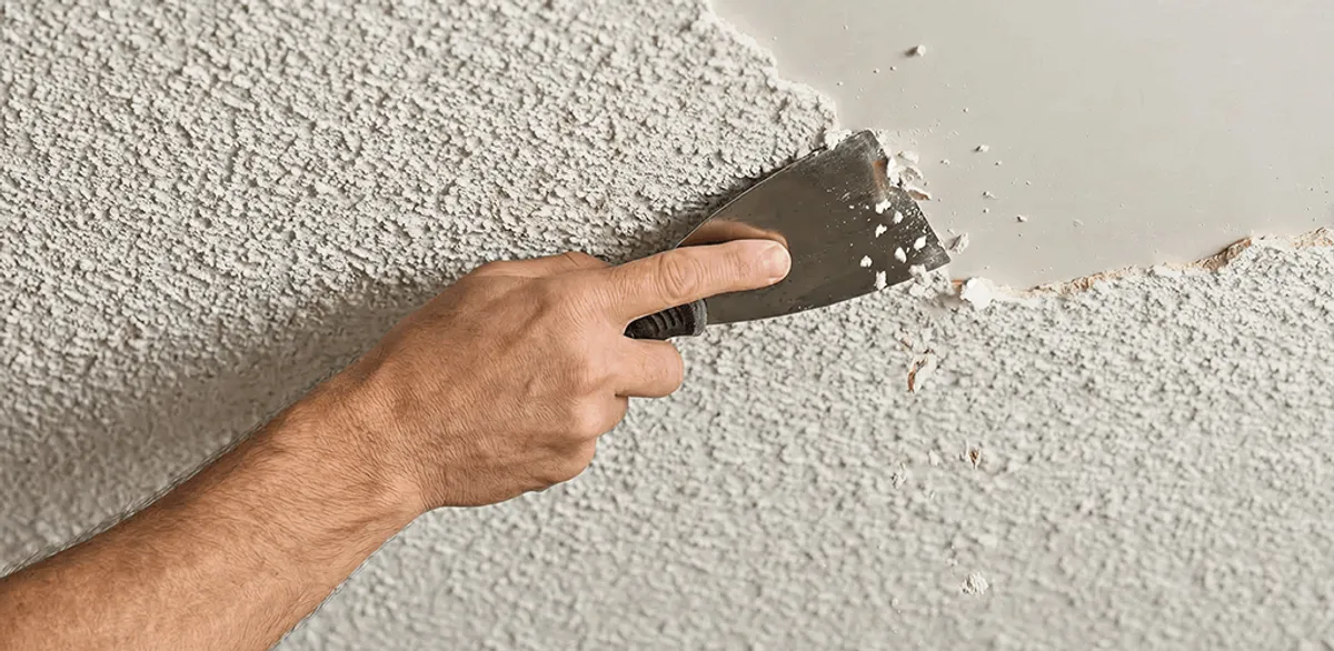 Popcorn ceiling removal scraping off textured ceiling finish in Riverside, CA