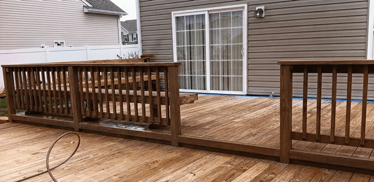 Deck sealing service protecting a backyard wood deck and railings in Riverside, CA