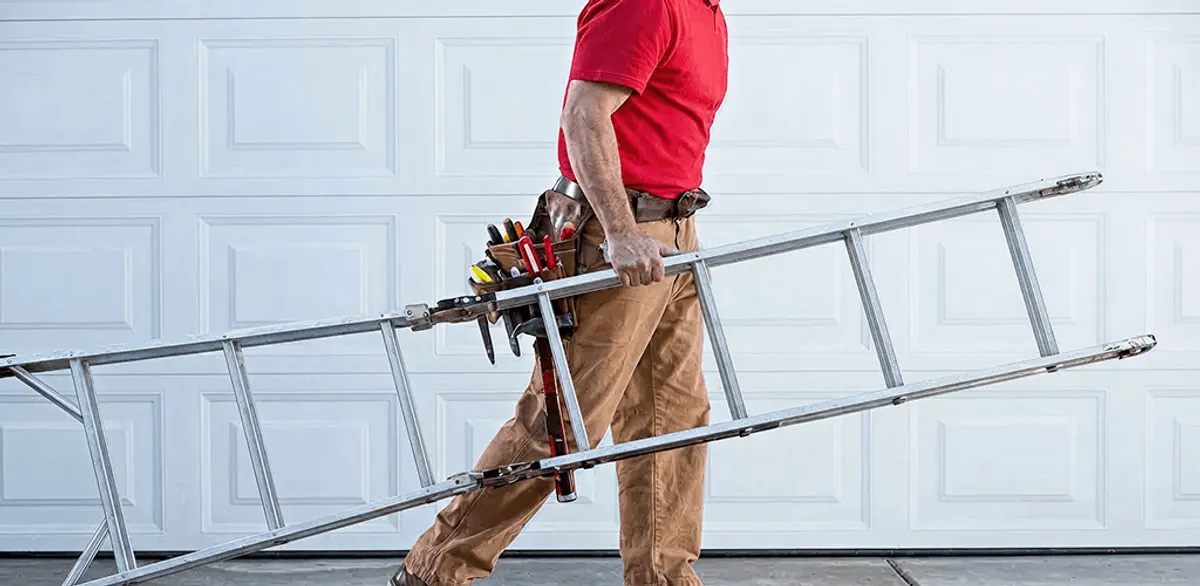 Garage door repair technician arriving with tools and ladder in Riverside, CA