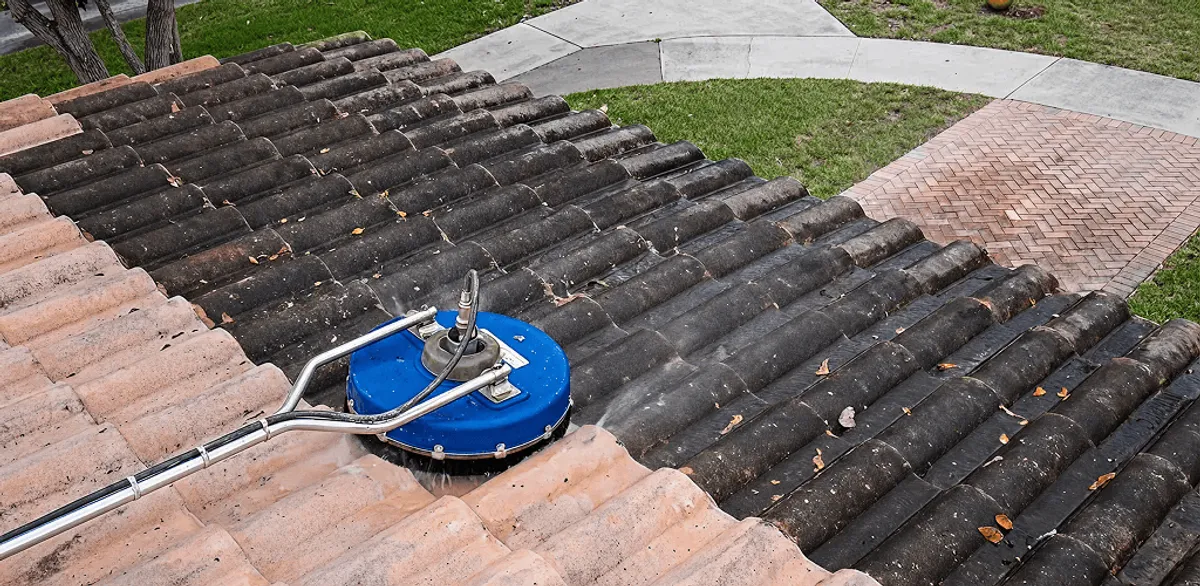 Roof pressure cleaning removing debris and buildup from roof tiles in Riverside, CA