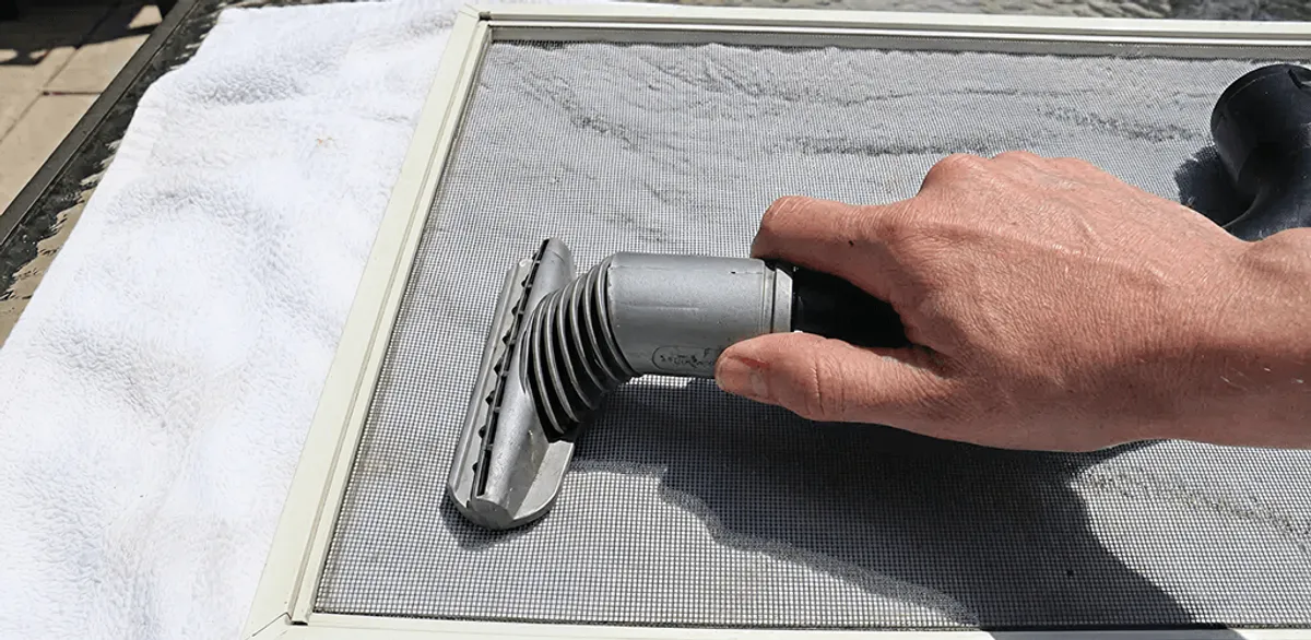 Window screen repair cleaning and fixing a damaged screen mesh in Riverside, CA